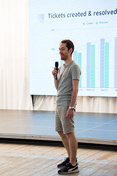 SOFTSWISS employee presenting performance statistics during a meeting.