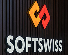 SOFTSWISS logo with red and yellow emblem on a dark textured background