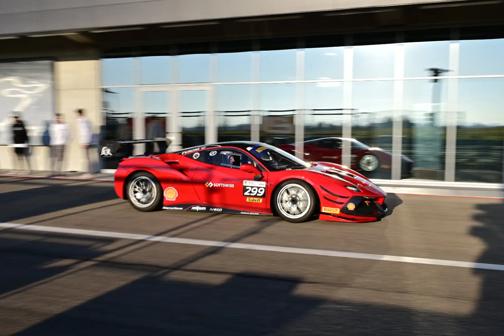 A Ferrari 488 Challenge car with SOFTSWISS logo