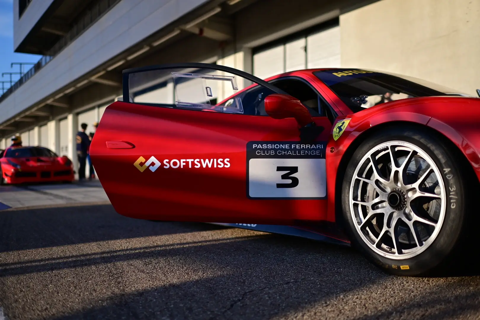 A Ferrari 488 Challenge car with SOFTSWISS logo